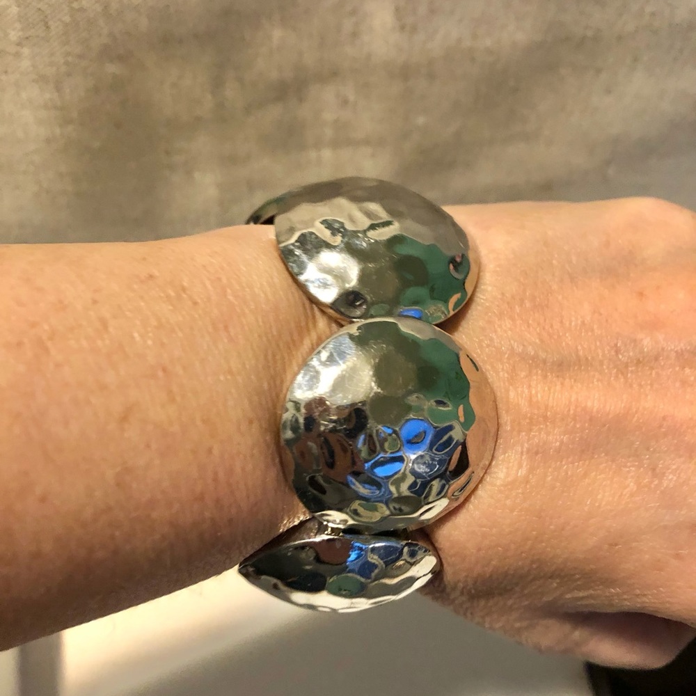 Silver tone stretch bracelet.